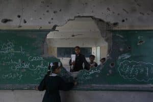 Photo: Anas al Baba/Oxfam – damaged school in Gaza, November 2014